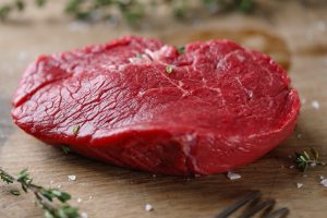 Raw Meat With Spices And Herbs On Table