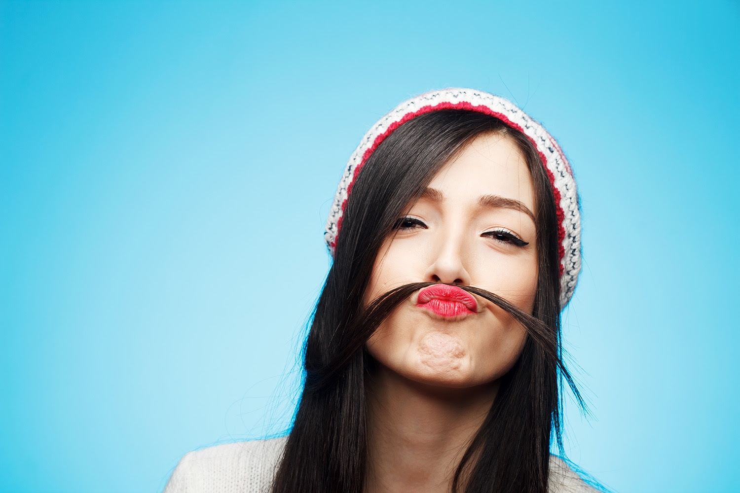 Cute Young Woman Pretending To Have A Mustache With Her Hair