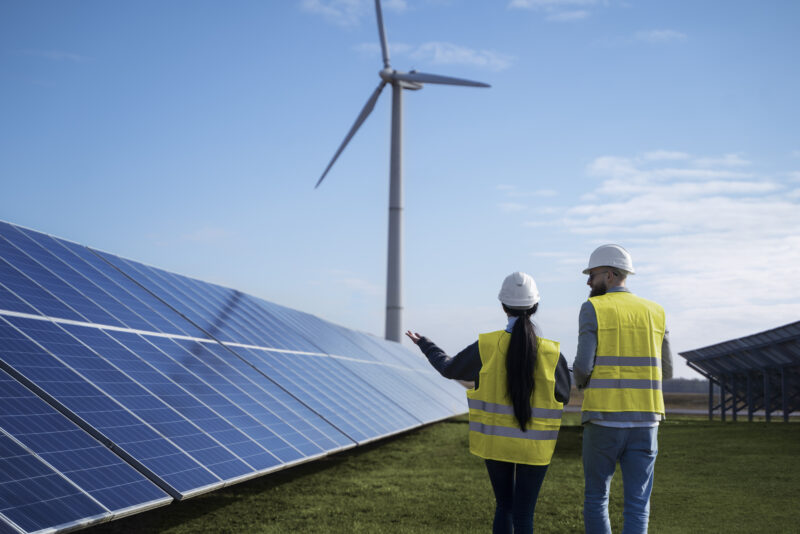 Medium Shot Engineers Discussing About Solar Pannels