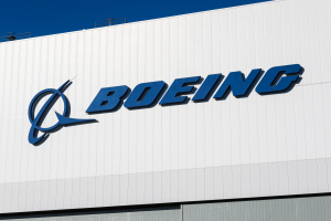 Seattle April 18, 2021; Boeing Corporation Logo On A White Building With Blue Sky In Seattle. Boeing Is A Leading Aerospace And Defence Manufacturing And The Largest Us Esporter