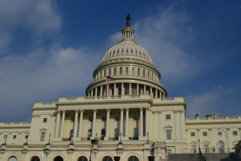 Flag Flying On The Us Capitol Building In Dc